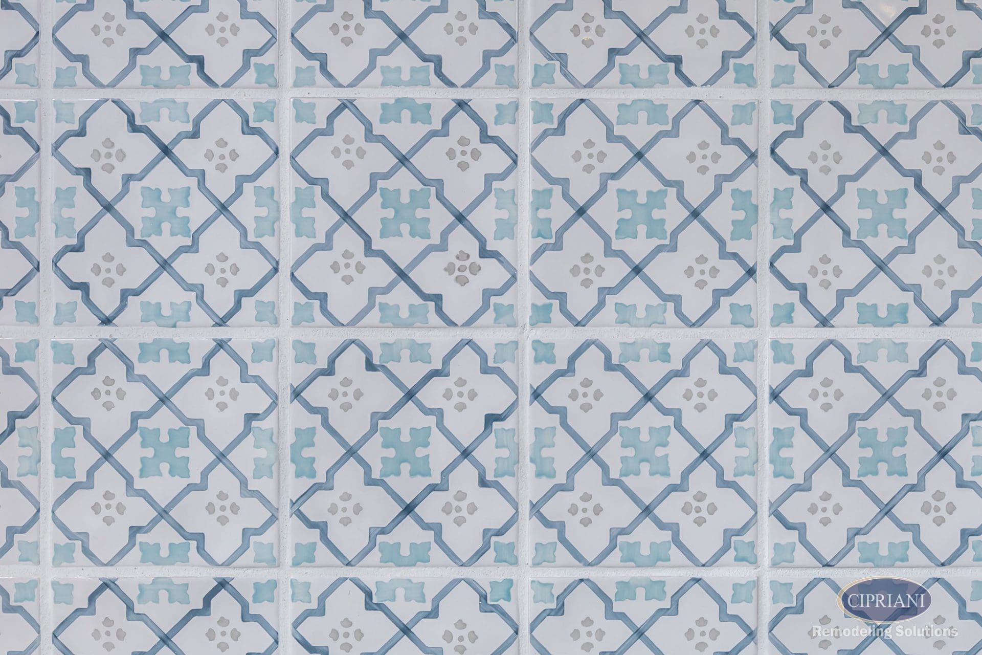Close-up of decorative blue and white patterned kitchen backsplash tile.