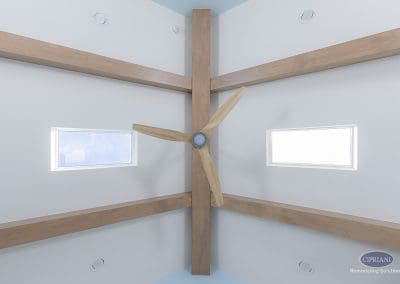 Ceiling beams with modern wood fan and narrow clerestory windows