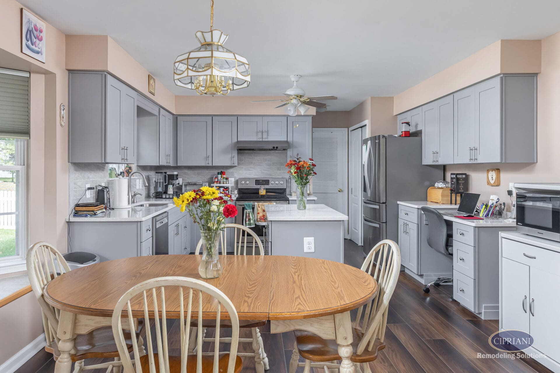 Gray Kitchen with Island and Workspace | Sicklerville Kitchen Remodel Gray Kitchen with Island and Home Office Nook – A Sicklerville kitchen remodel showcasing gray shaker cabinetry, a quartz island, and a built-in workspace integrated into the layout.