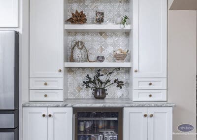 Timeless Gathering Mount Laurel Kitchen Remodel: Custom beverage station with open shelving, patterned tile backsplash, marble countertop, and integrated beverage refrigerator for entertaining convenience.