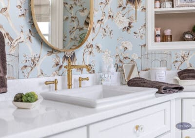 White vanity with brass faucet and blue chinoiserie wallpaper in Mullica Hill bathroom remodel