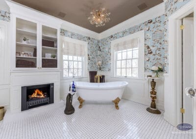Freestanding tub with fireplace and built-in cabinetry in Mullica Hill bathroom remodel