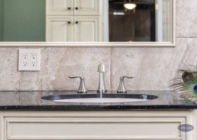 Bathroom sink and brushed nickel faucet with stone backsplash in Wenonah NJ bathroom remodel