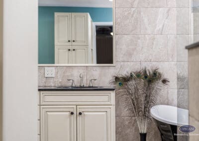 Bathroom vanity and mirror with stone tile wall in Wenonah NJ bathroom remodel