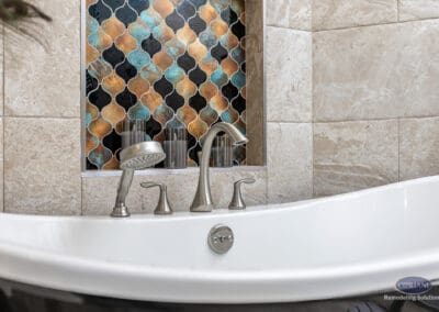 Freestanding bathtub with brushed nickel faucet and accent tile niche in Wenonah NJ bathroom remodel