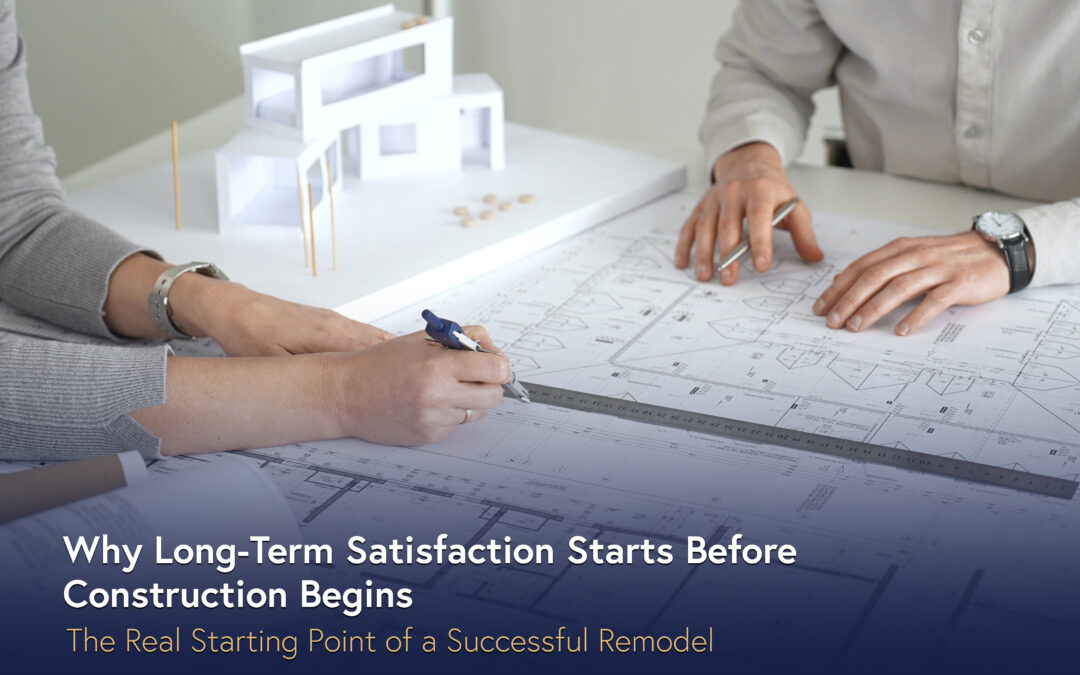 Remodeling professionals reviewing construction plans and design layouts during a pre-construction planning meeting for a home remodel.